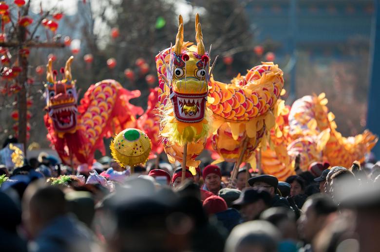 File Photo: Folk artists perform a dragon dance during celebrations on the eight day of Chinese Lunar New Year of the Pig, in Hohhot, Inner Mongolia Autonomous Region, China February 12. REUTERS/Stringer