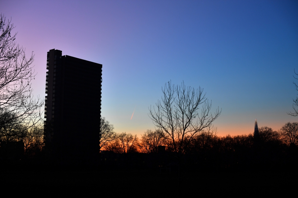 The Shard and a tower block are seen as the sun sets over the skyline in London, Britain, January 20, 2020. Picture taken January 20, 2020. REUTERS/Dylan Martinez