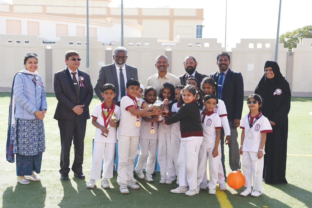 SIS KG and Primary section students with officials.