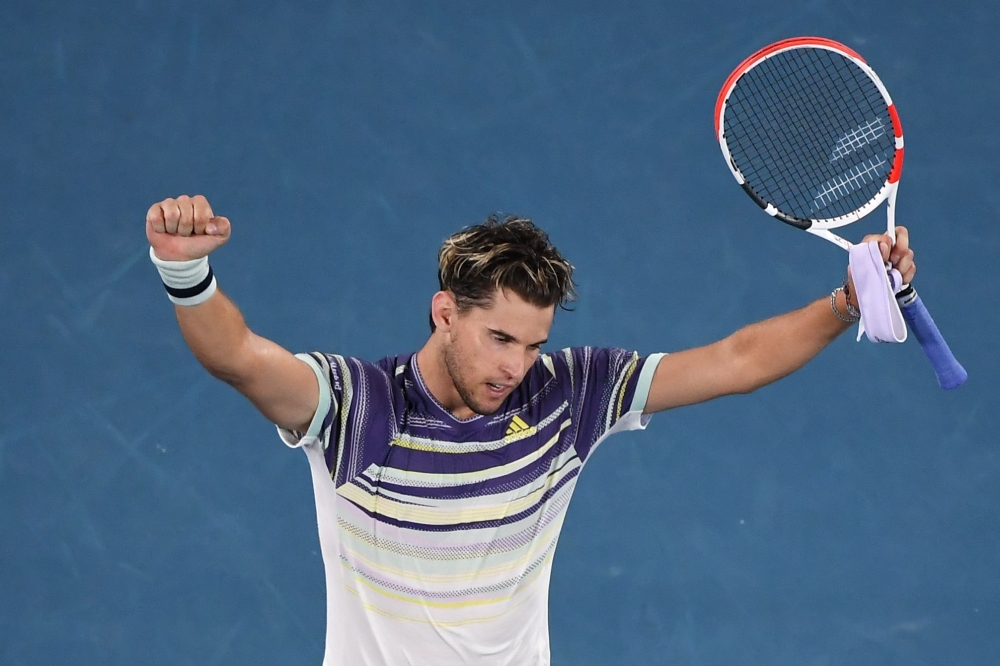 Austria's Dominic Thiem celebrates after victory against Spain's Rafael Nadal during their men's singles quarter-final match on day ten of the Australian Open tennis tournament in Melbourne on January 29, 2020. AFP / Manan Vatsyayana 