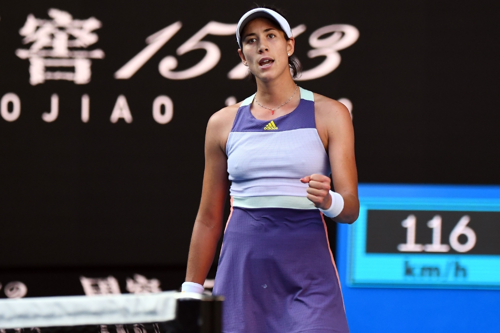 Spain's Garbine Muguruza celebrates after beating Romania's Simona Halep during their women's singles semi-final match on day eleven of the Australian Open tennis tournament in Melbourne on January 30, 2020. AFP / William West 