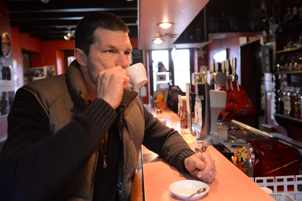  British' Mark Lawrence, 48 years old, working as carpenter, drinks a coffee in a cafe in Plazac village (Dordogne), on January 23, 2020. (AFP / MEHDI FEDOUACH)
