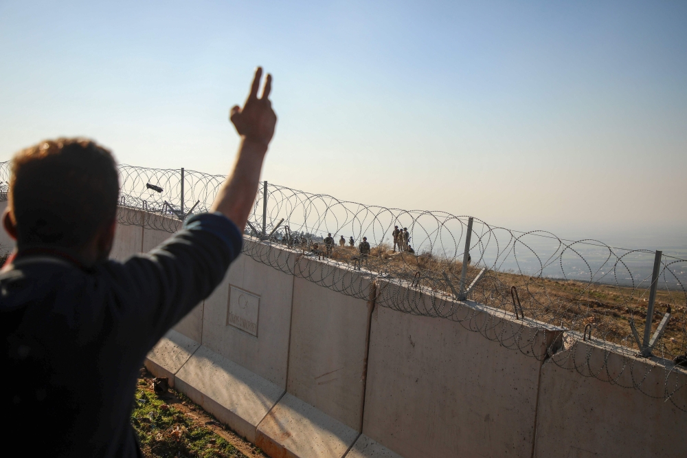 Syrians gather during a symbolic protest in the city of Harem in the rebel-held northern countryside of Syria's Idlib on the border with Turkey on February 2, 2020.( AFP / AAREF WATAD)