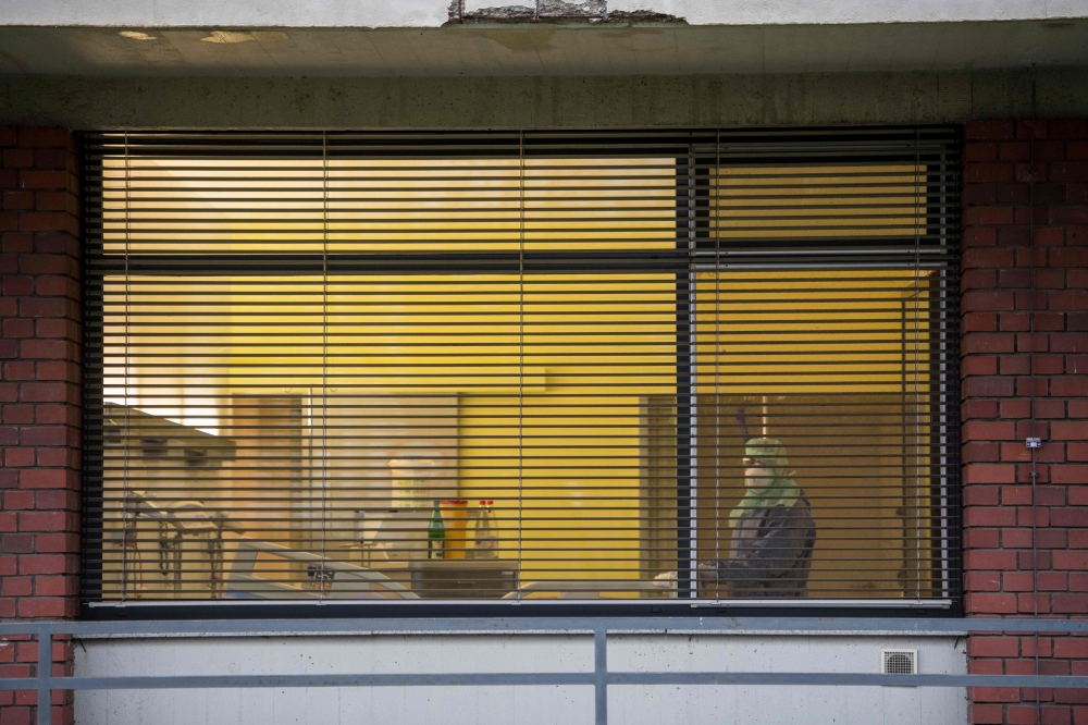 Medical staff clean a hospital room in the infectiology and isolation unit of the Frankfurt Goethe University hospital in Frankfurt am Main, western Germany on February 2, 2020. AFP / Thomas Lohnes
 