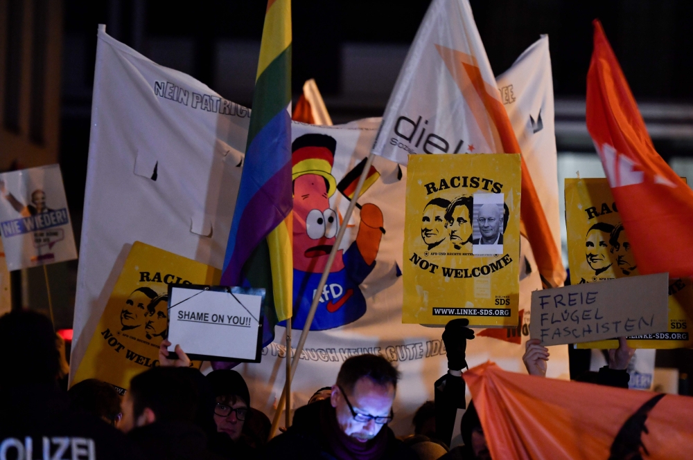 Protestors hold a rally outside the heahquaters of the Free Democratic Party (FDP) in Berlin on February 5, 2020. AFP / John MacDougall