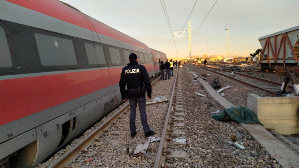 Police are seen at the scene where a high-speed train travelling from Milan to Bologna derailed, in Lodi, Italy February 6, 2020. Polizia di Stato