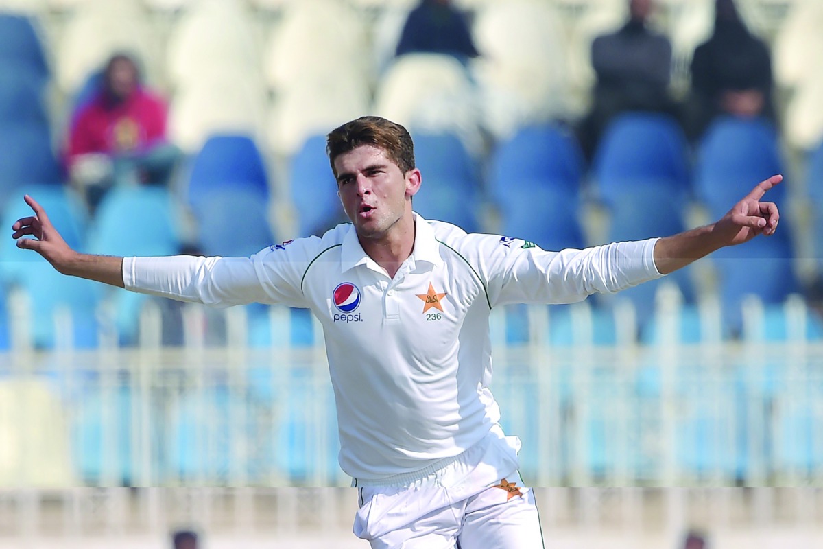 Pakistan's Shaheen Shah Afridi celebrates after taking the wicket of Bangladesh's Mominul Haque (unseen) during the first day of the first cricket Test match between Pakistan and Bangladesh at the Rawalpindi Cricket Stadium in Rawalpindi on February 7, 20