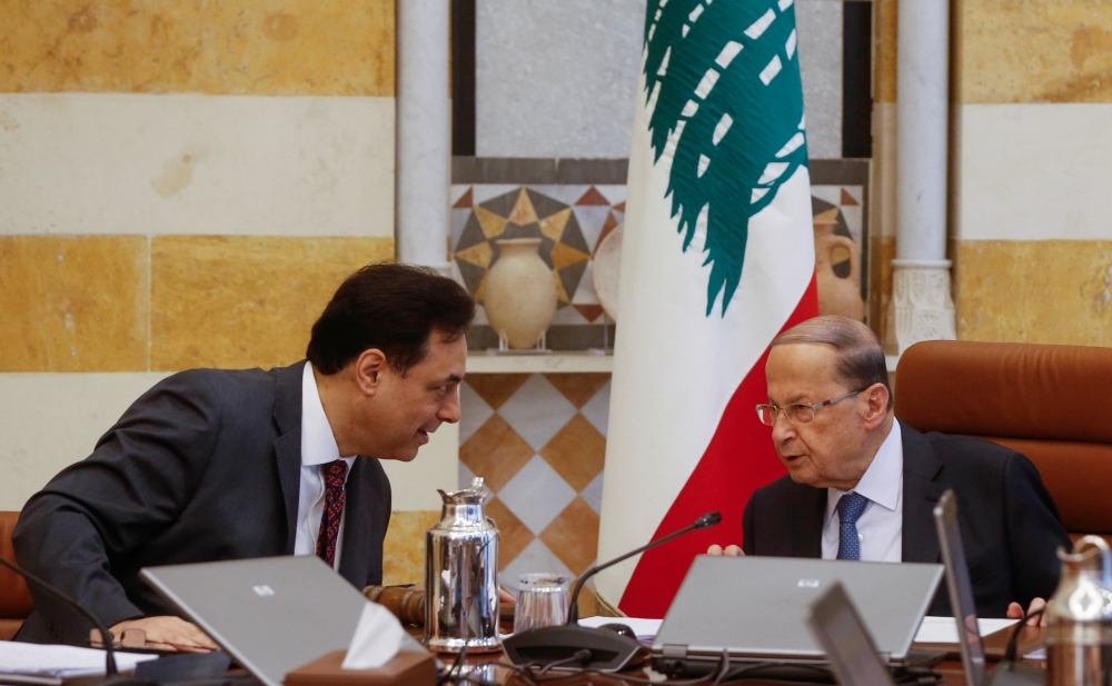 Lebanon's Prime Minister Hassan Diab speaks with Lebanon's President Michel Aoun during a cabinet meeting at the presidential palace in Baabda, Lebanon February 6, 2020. REUTERS/Mohamed Azakir