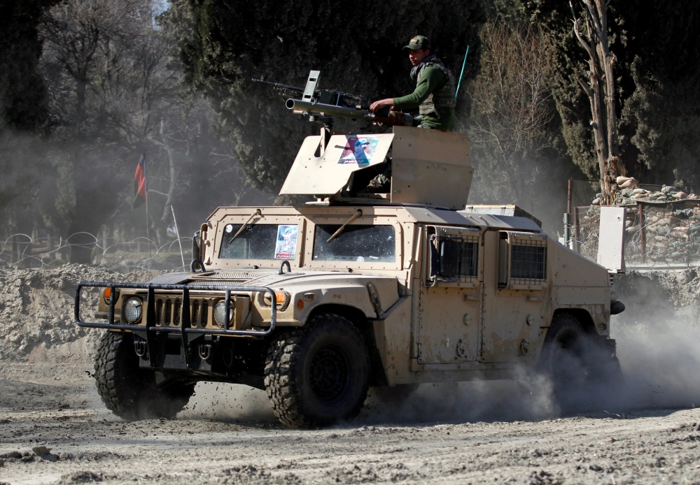 An armoured vehicle patrols near the side of an incident where two U.S soldiers were killed a day before in Shirzad district of Nangarhar province, Afghanistan February 9, 2020.REUTERS/Parwiz