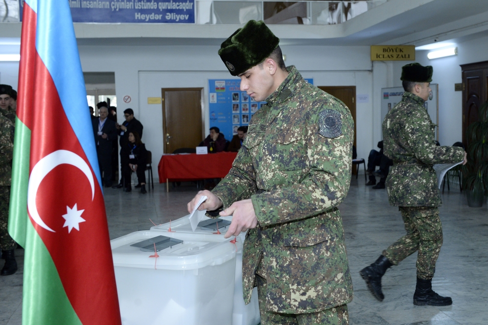 Azerbaijan's servicemen vote at a polling station during the parliamentary elections in Baku on February 9, 2020. AFP / Tofik Babayev 