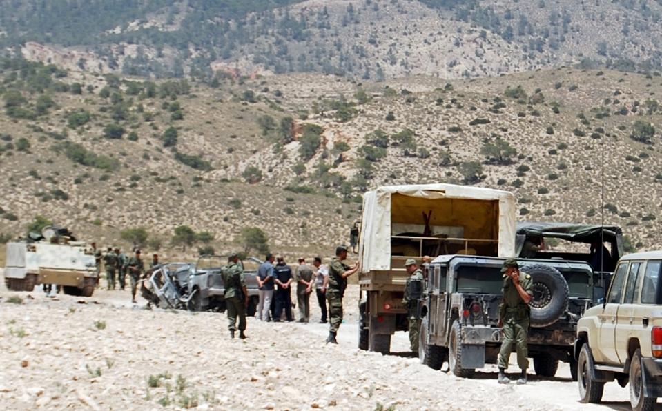 Representative image (Tunisian soldiers stand guard in the mountainous border region near Algeria where security forces have been hunting Al-Qaeda linked jihadists on June 6, 2013. AFP / Abderrazek Khlifi) 