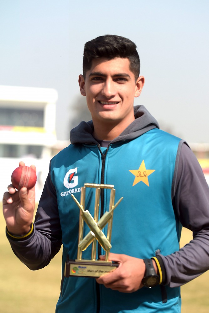 Pakistan's Naseem Shah, who yesterday got a hat-trick, holds a ball and an award after Pakistan won the first cricket Test match against Bangladesh at the Rawalpindi Cricket Stadium in Rawalpindi on February 10, 2020.  AFP / Aamir Qureshi