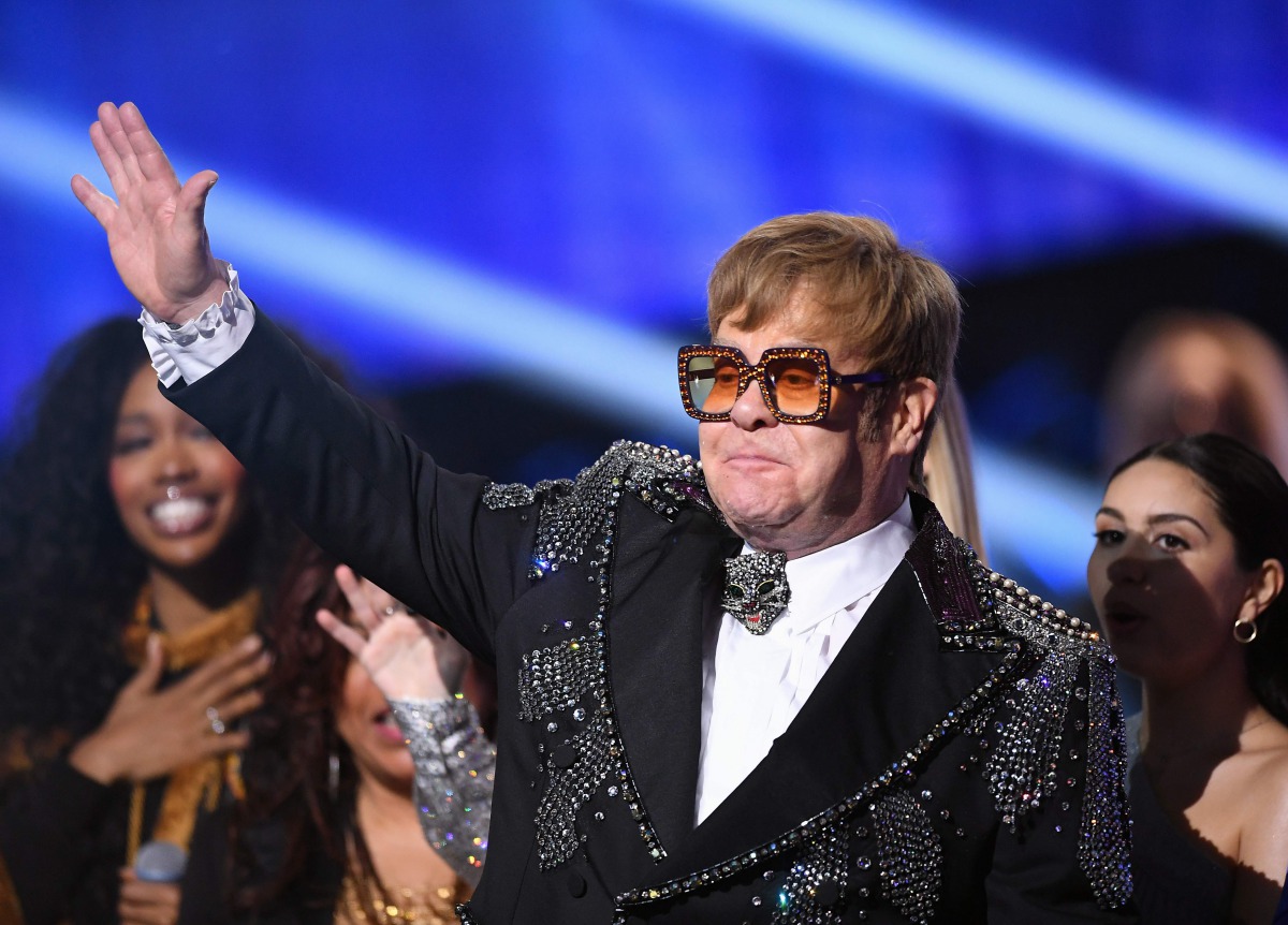 In this file photo taken on January 31, 2018 Elton John waves to fans on stage during the 