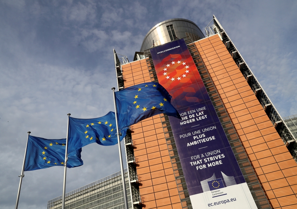 European Union flags fly outside the European Commission headquarters in Brussels, Belgium, December 19, 2019. Reuters/Yves Herman