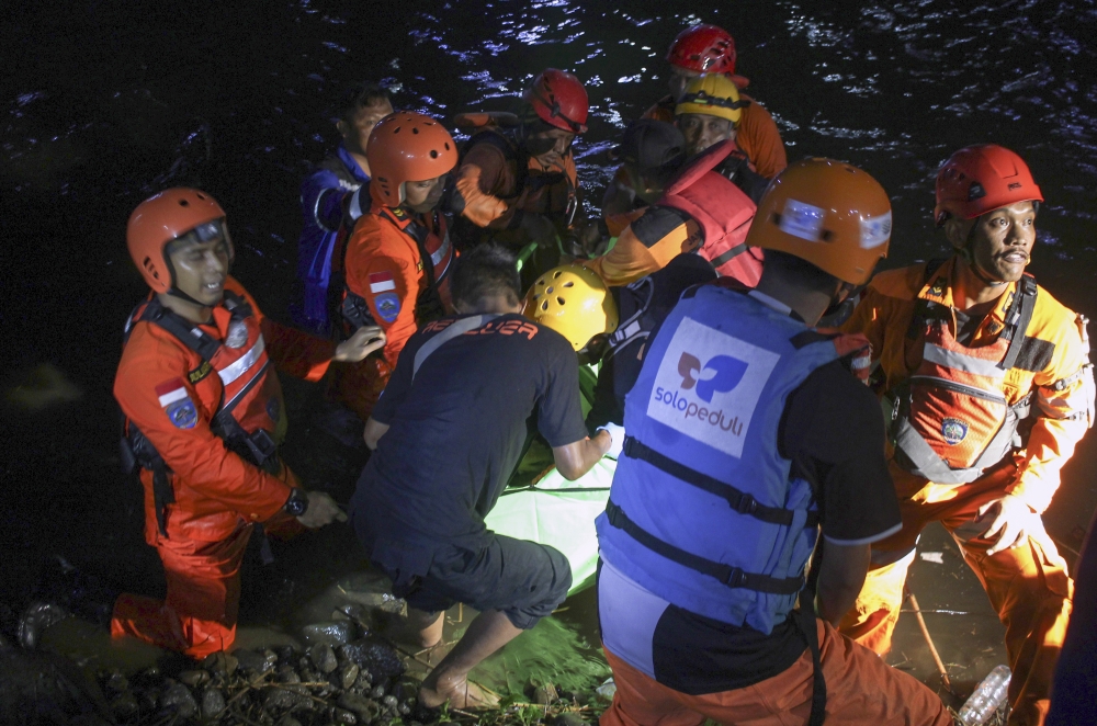 Rescue teams find a victim lost after the flash flood in the Sempor River in Sleman, Yogyakarta, Indonesia on 22 February, 2020. 