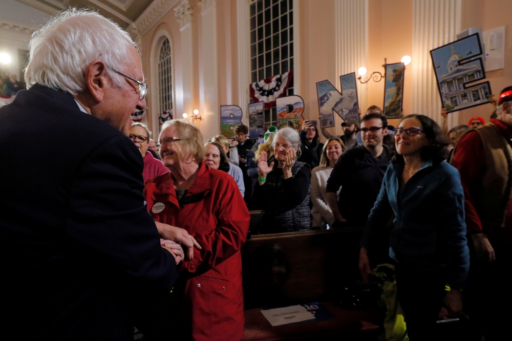 Bernie Sanders greets audience members at a campaign town hall meeting in Portsmouth, New Hampshire, US, November 24, 2019. Reuters / Brian Snyder