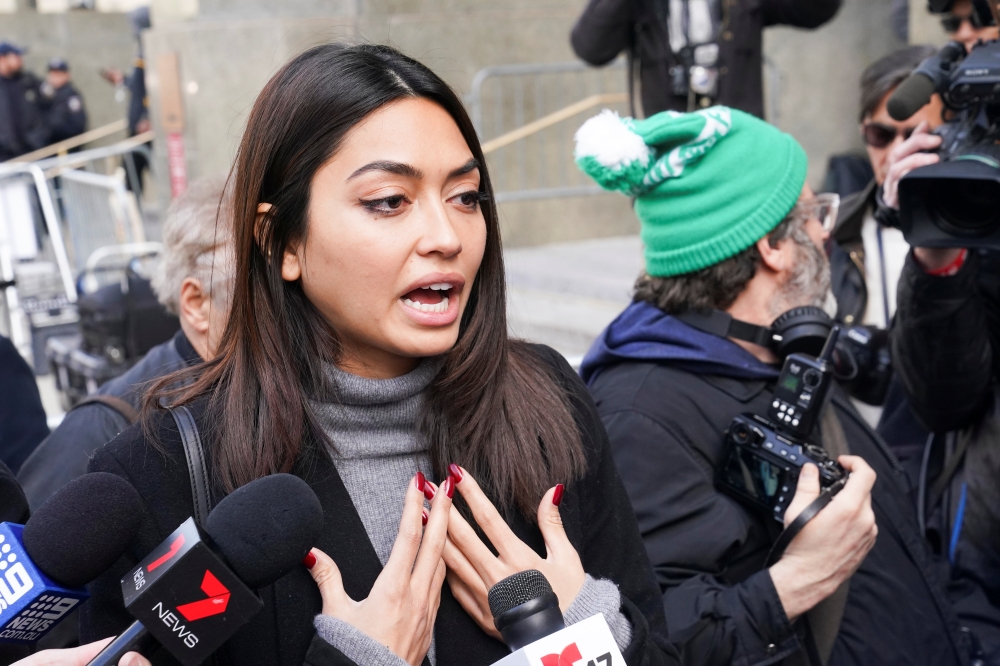 Model Ambra Battilana Gutierrez talks to the media following film producer Harvey Weinstein's guilty verdict in his sexual assault trial in New York, US February 24, 2020. Reuters/Carlo Allegri
 Model Ambra Battilana Gutierrez talks to the media followin