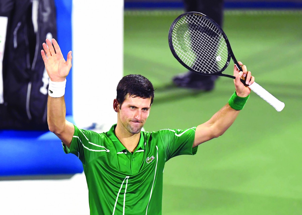 Serbia's Novak Djokovic greets the public after defeating Tunisia's Malek Jaziri during round 1 of the Dubai Duty Free Tennis Championships in the United Arab Emirates, on February 24, 2020.  AFP / Karim Sahib
