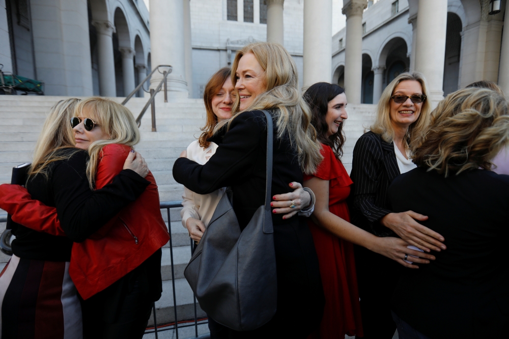 The Silence Breakers, a group of women who spoke out about Harvey Weinstein's sexual misconduct hug after a news conference outside Los Angeles City Hall a day after the Harvey Weinstein verdict in Los Angeles, US, February 25, 2020. Reuters/Mike Blake