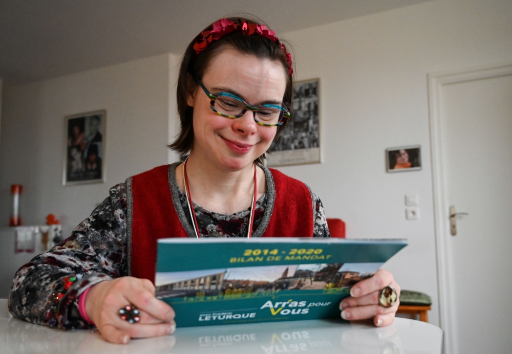 Eleonore Laloux, a young woman with Down syndrome, poses at her home in Arras, northern France, on February 13, 2020. AFP / DENIS CHARLET