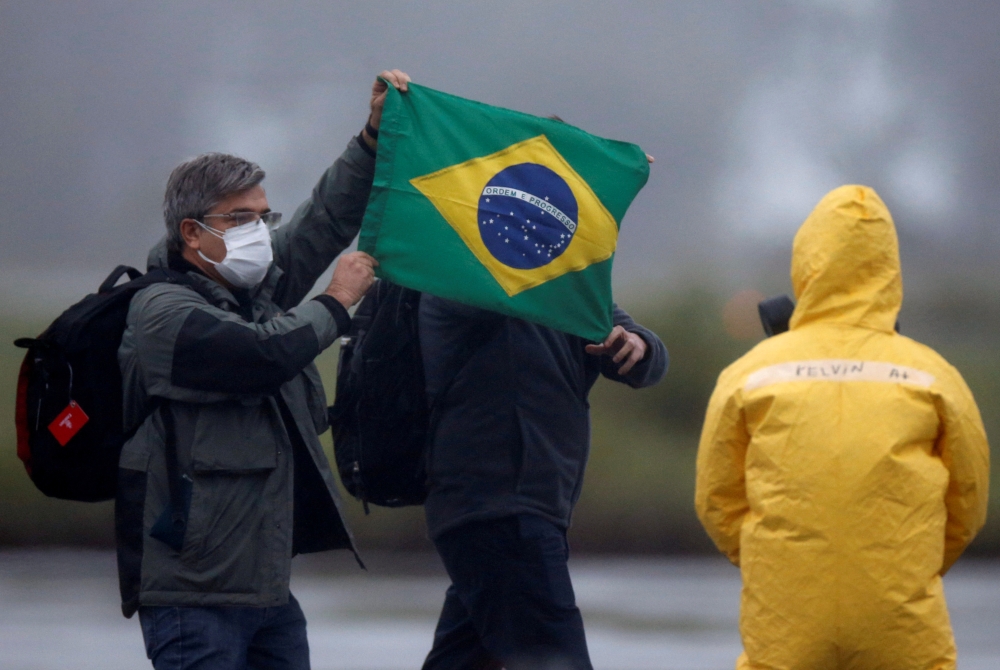 FILE PHOTO: Brazilian citizens from China's coronavirus-struck Wuhan, arrive at the Air Force base of Anapolis, State of Goias, Brazil, February 9, 2020. REUTERS/Adriano Machado/File Photo