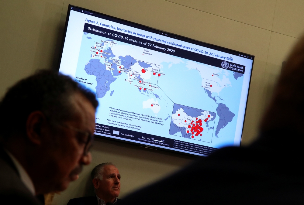  A map showing the distribution of coronavirus (COVID-2019) cases all around the world as of 22 February 2020 is displayed on a TV during a World Health Organization (WHO) news conference on the situation of the coronavirus (COVID-2019) in Geneva, Switzer