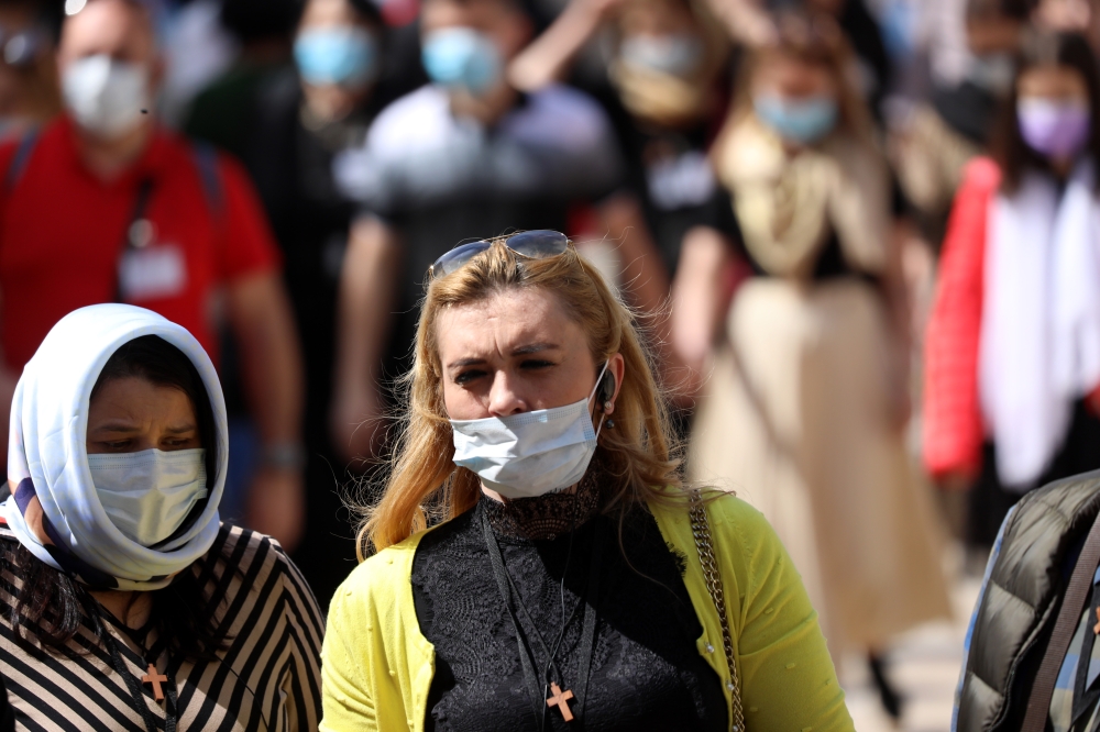 Palestinian citizens wear masks to protect themselves from coronavirus (COVID-19) at public places in Bethlehem, West Bank on March 05, 2020. (Wisam Hashlamoun / Anadolu Agency)