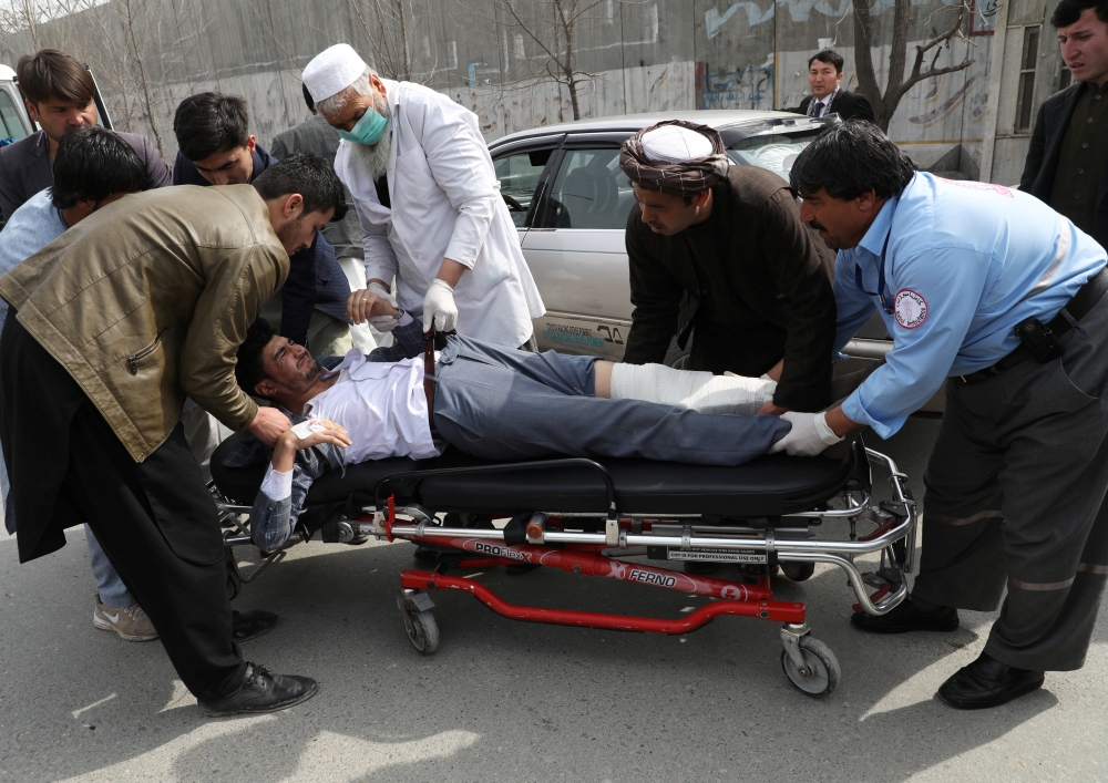 Hospital workers carry an injured person to an ambulance at a hospital after an attack in Kabul, Afghanistan March 6, 2020. Reuters/Omar Sobhani 