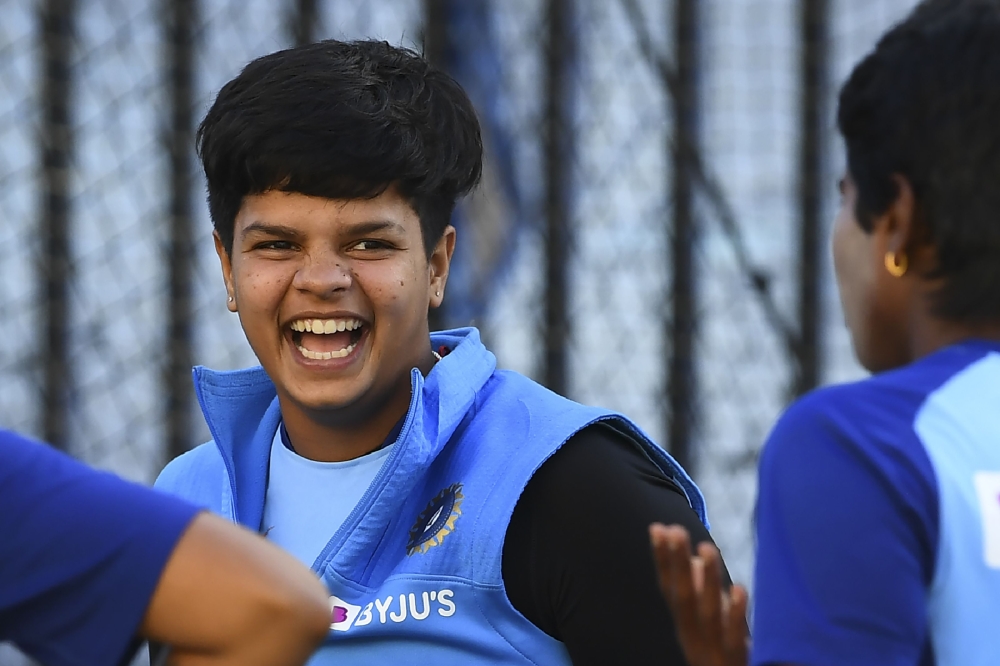 India's Shafali Verma (C) shares a lighter moment with teammates in the nets ahead of the Twenty20 women's World Cup cricket final, in Melbourne on March 7, 2020. AFP / William West  
