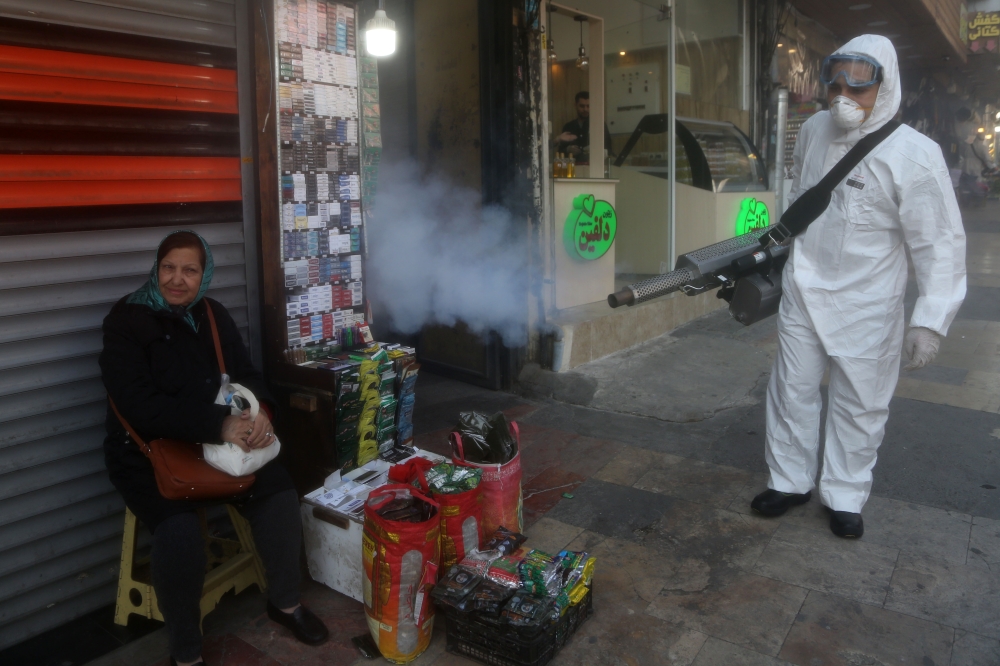 Fire fighter teams with protective suits disinfect the Tajrish Bazaar as a precaution to the coronavirus (Covid-19) in Tehran, Iran on March 06, 2020. Fatemeh Bahrami - Anadolu