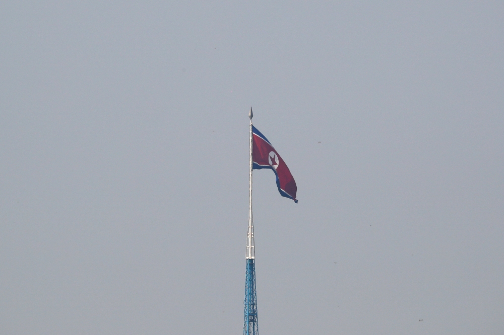 North Korean flag flutters on top of the 160-metre tall tower at North Korea's propaganda village of Gijungdong, in this picture taken from Tae Sung freedom village near the Military Demarcation Line (MDL), inside the demilitarised zone separating the two