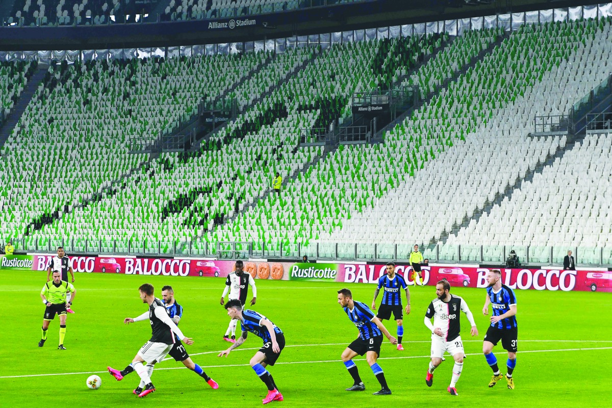 Inter Milan and Juventus players compete in an empty stadium due to the novel coronavirus outbreak during the Italian Serie A football match Juventus vs Inter Milan, at the Juventus stadium in Turin on March 8, 2020. AFP / Vincenzo Pinto
