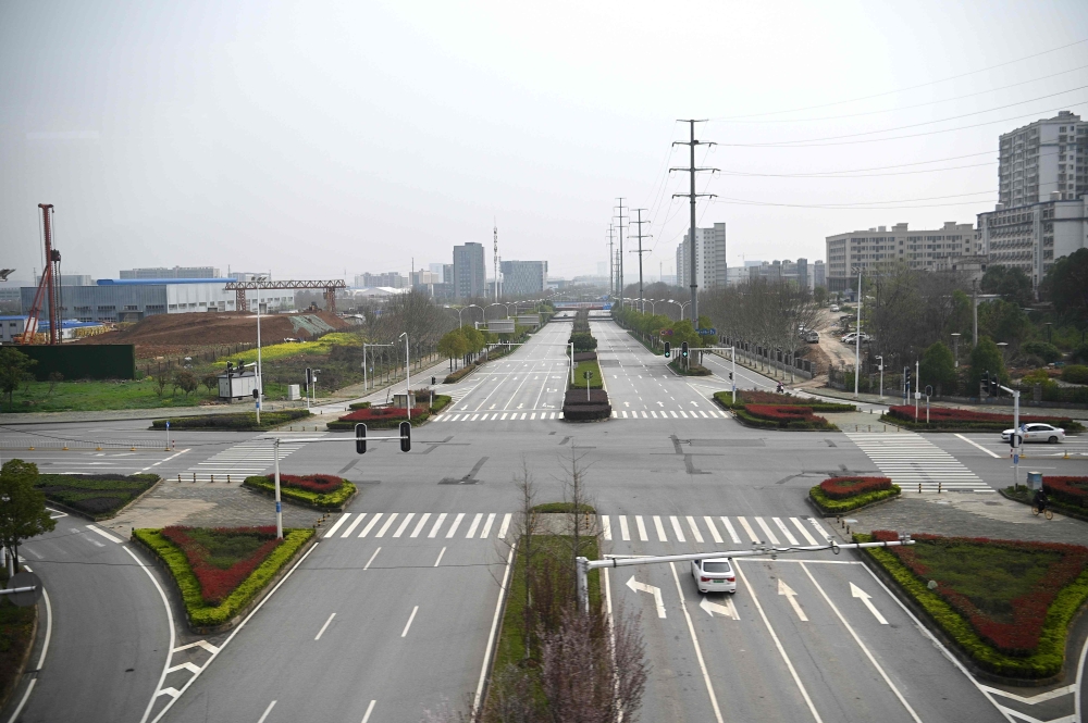 A general view shows an empty street in Wuhan, China's central Hubei province on March 10, 2020. Chinese President Xi Jinping arrived in Wuhan on March 10 for his first visit to the epicentre of the coronavirus epidemic since the crisis erupted in January