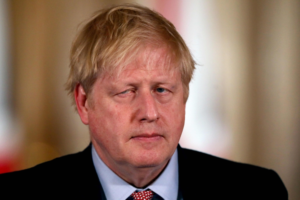 Britain's Prime Minister Boris Johnson speaks at a news conference addressing the government's response to the novel coronavirus COVID-19 outbreak, at 10 Downing Street in London on March 12, 2020. AFP pool / Simon Dawson 