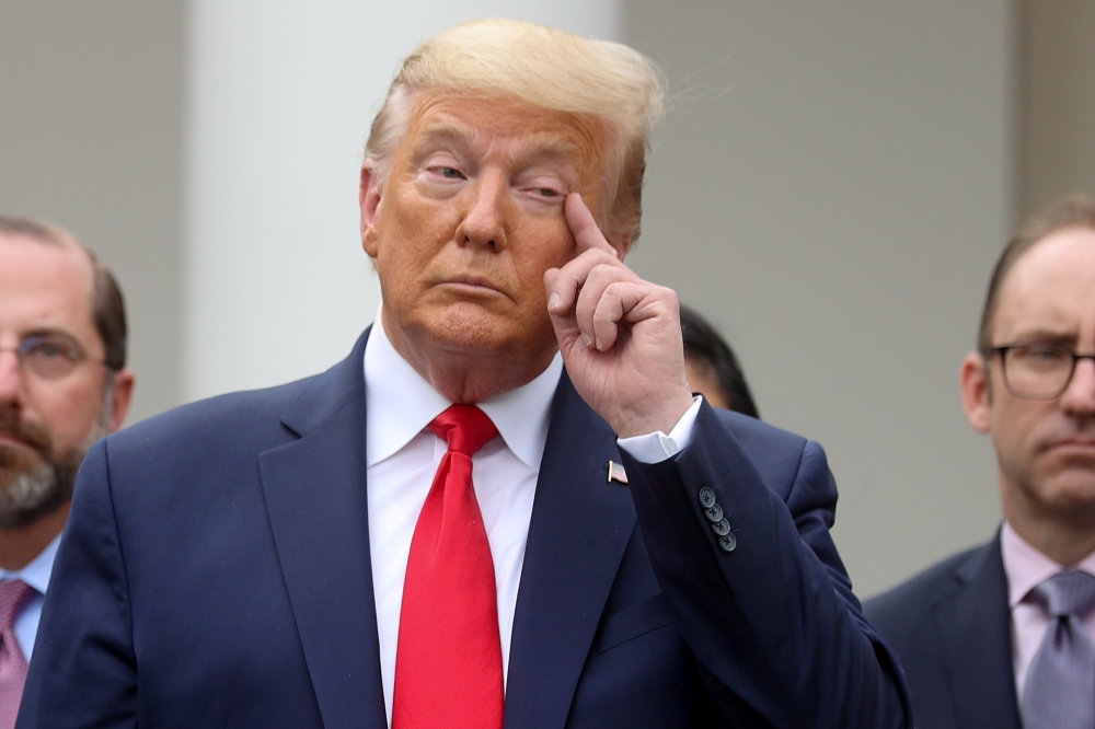 U.S. President Donald Trump pauses during a news conference where he declared the coronavirus pandemic a national emergency in the Rose Garden of the White House in Washington, U.S., March 13, 2020. Reuters/Jonathan Ernst