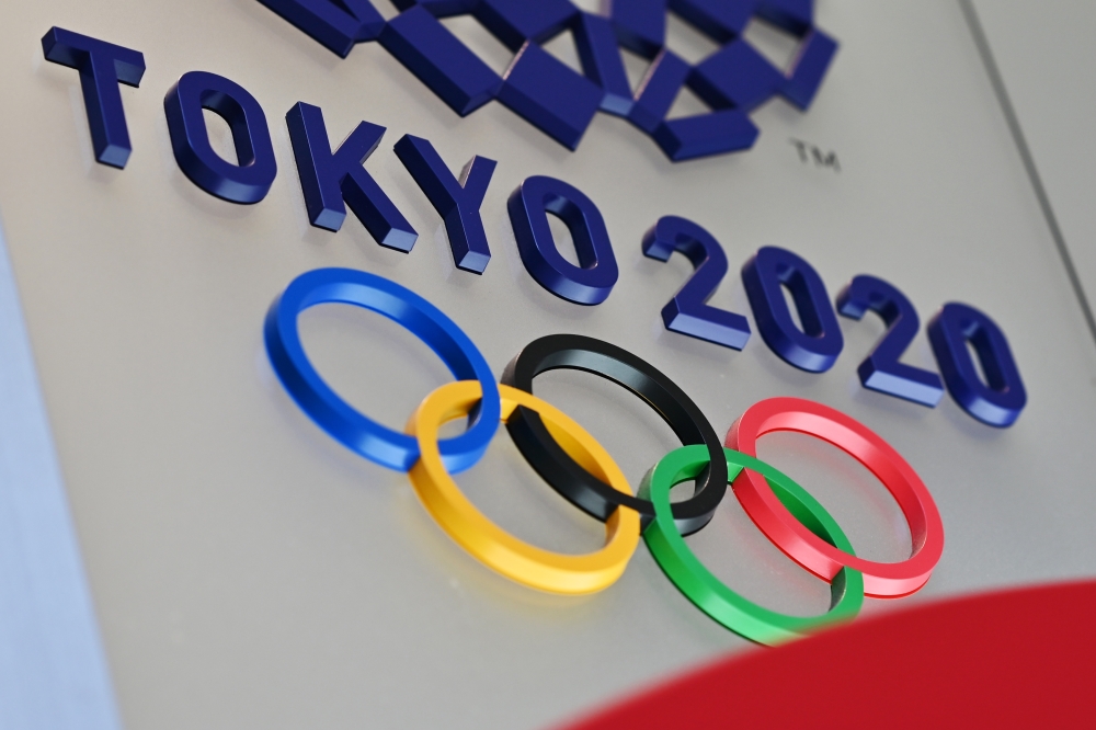 The logo for the Tokyo 2020 Olympic Games is seen in Tokyo on March 15, 2020. / AFP / CHARLY TRIBALLEAU 