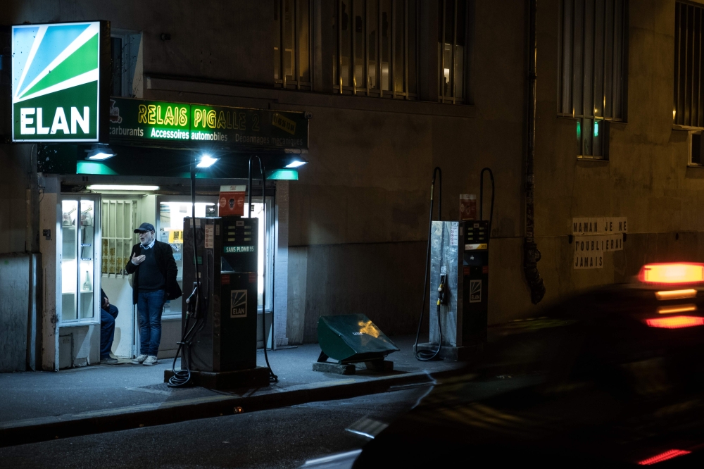 A petrol station in the Pigalle area after all non-essential public places including restaurants and cafes have been shut as a precaution to contain the spread of the COVID-19, caused by the novel coronavirus. AFP / JOEL SAGET