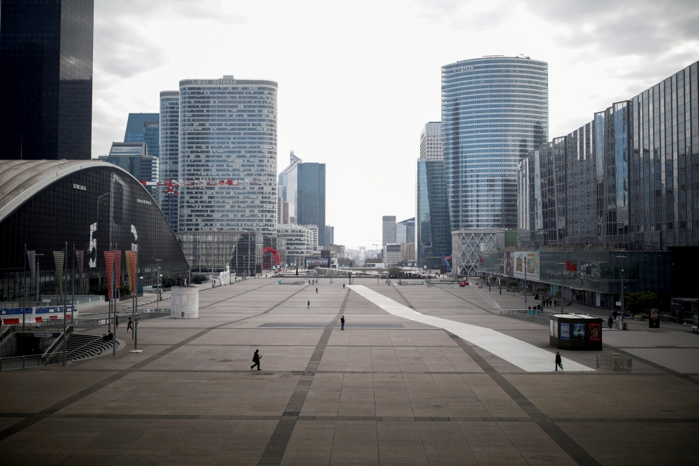 FILE PHOTO: A view shows the deserted business district of La Defense as lockdown is imposed to slow the spreading of the coronavirus disease (COVID-19) in Paris, France, March 18, 2020. REUTERS/Benoit Tessier