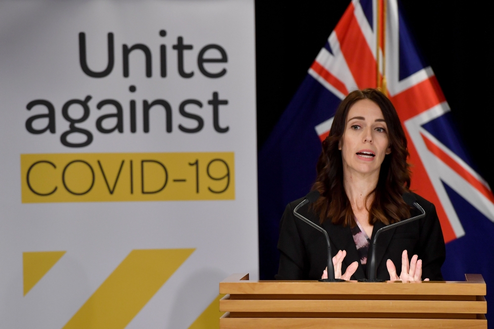 New Zealand's Prime Minister Jacinda Ardern speaks to the media during a press conference one day before the country goes on lockdown to stop any progress of the COVID-19 coronavirus, at Parliament in Wellington on March 24, 2020. / AFP / Marty MELVILLE