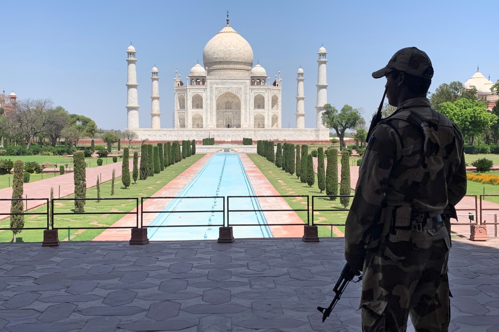 A Central Industrial Security Force (CISF) personnel stands guard inside the empty premises of the historic Taj Mahal during a 21-day nationwide lockdown to slow the spreading of the coronavirus disease (COVID-19), in Agra, India, April 2, 2020. Reuters/S