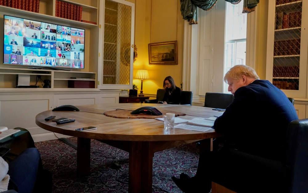 File photo: Boris Johnson sits in the study of 10 Downing Street on a video conference call to other G20 leaders on coronavirus outbreak in London Britain March 26, 2020. Andrew Parsons / 10 Downing Street via Reuters