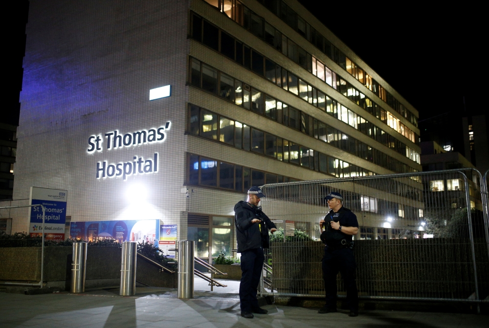 FILE PHOTO: Police officers outside of the St Thomas' Hospital after British Prime Minister Boris Johnson was moved to intensive care after his coronavirus (COVID-19) symptoms worsened and has asked Foreign Secretary Dominic Raab to deputise. London, Brit