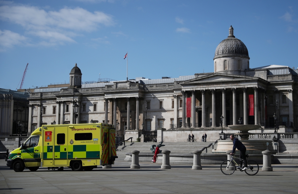 An ambulance is seen in Trafalgar Square in London, as the spread of the coronavirus disease (COVID-19) continues, London, Britain, April 13, 2020. REUTERS/Hannah McKay
