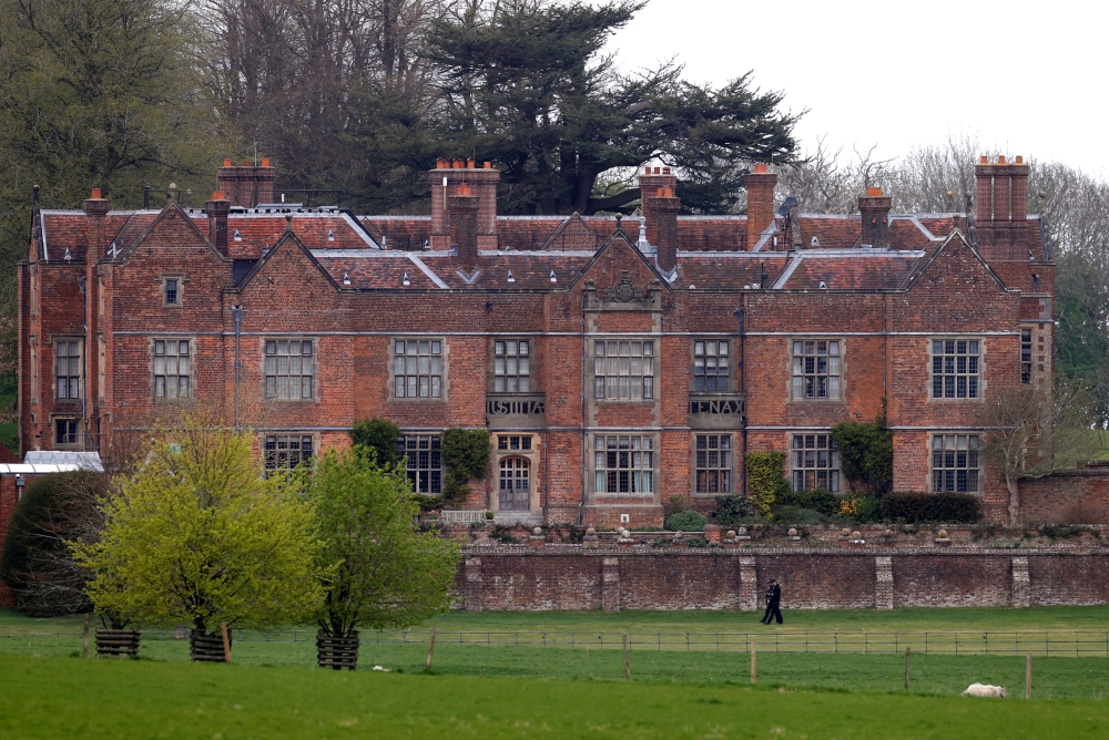 Armed Police officers are seen on the grounds of Chequers, the Prime Minister's official country residence, after British Prime Minister Boris Johnson was discharged from hospital on Sunday recovering from coronavirus disease (COVID-19), Aylesbury, Britai