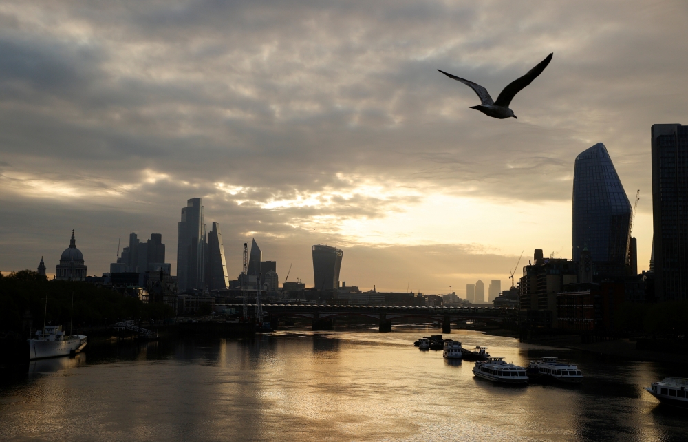 The city of London financial district and the river Thames are seen in early morning, as the spread of coronavirus disease (COVID-19) continues in London, Britain, April 19 2020. REUTERS/John Sibley TPX IMAGES OF THE DAY