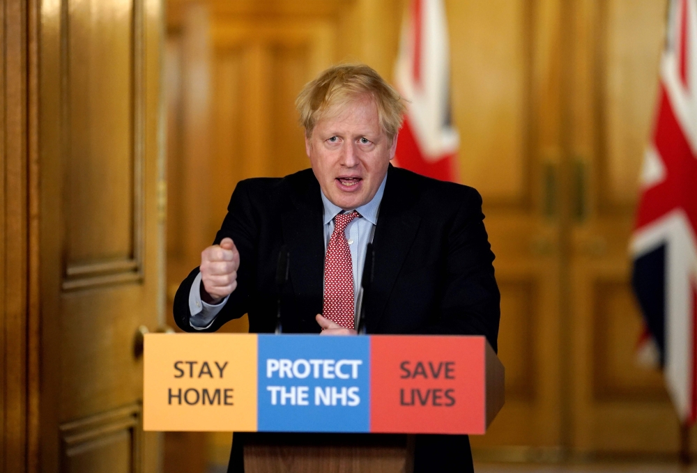 (FILES) In this file photo taken on March 25, 2020 A handout image released by 10 Downing Street, shows Britain's Prime Minister Boris Johnson speaking during a remote press conference to update the nation on the Covid-19 pandemic, in side 10 Downing Stre