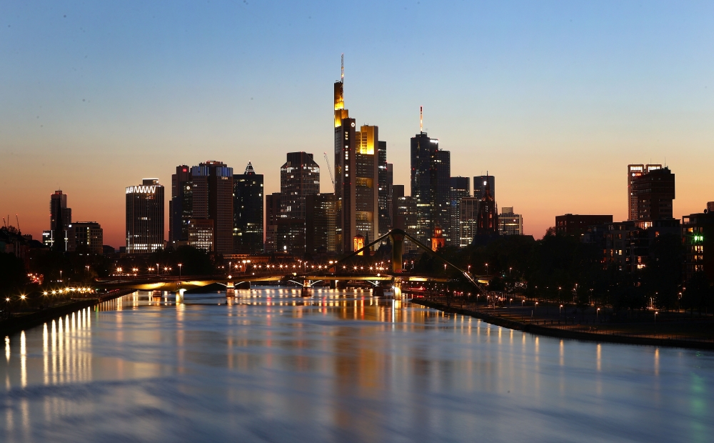 :The skyline with its financial district is photographed during sunset in Frankfurt, Germany, April 22, 2020, as the spread of the coronavirus disease (COVID-19) continues. REUTERS/Kai Pfaffenbach