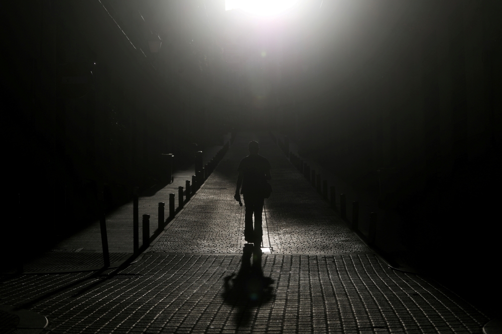 A man walks down an empty street, amid the coronavirus disease (COVID-19) outbreak in Madrid, Spain, April 24, 2020. REUTERS/Susana Vera TPX IMAGES OF THE DAY
 