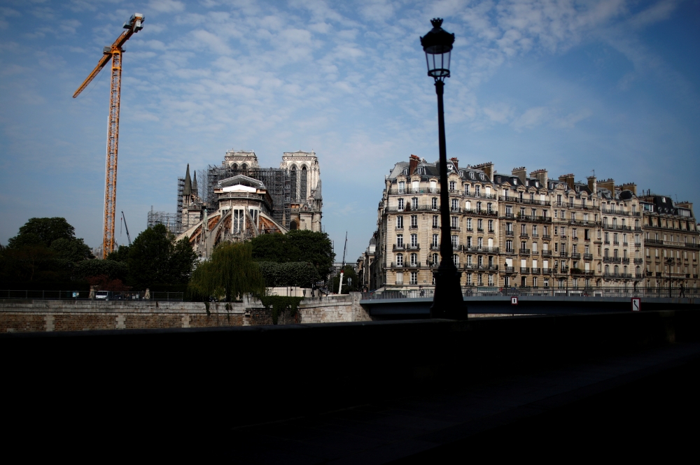 A view shows Notre-Dame de Paris Cathedral, which was damaged in a devastating fire one year ago, as restoration work resumes slowly after an interruption due to the lockdown imposed to slow the rate of the coronavirus disease (COVID-19) in Paris, France,