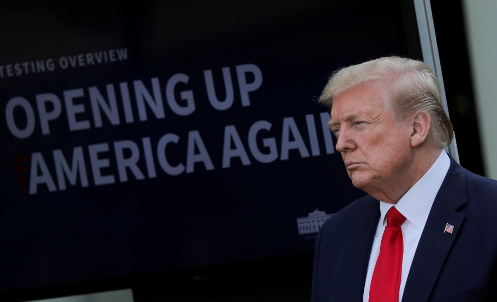 U.S. President Donald Trump attends a coronavirus response news conference in the Rose Garden at the White House in Washington, U.S., April 27, 2020. REUTERS/Carlos Barria TPX IMAGES OF THE DAY
